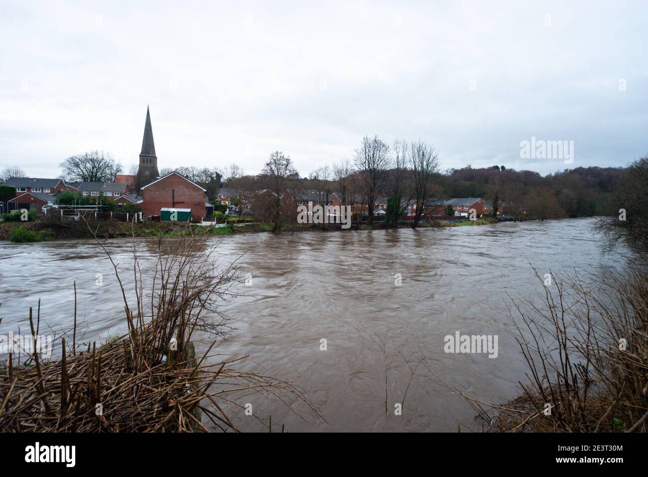 Prestolee, Bolton, England, UK. 20th Jan 2021. Consistent rainfall from Storm Christoph over the last 24 hours has led to the level of the River Irwell rising significantly. A flood warning has now been issued for the River Irwell at Prestolee and Ringley bridges. The village of Prestolee experienced flooding in 2015 and 2020 when the Irwell burst its banks. Credit: Callum Fraser/Alamy Live News Stock Photo