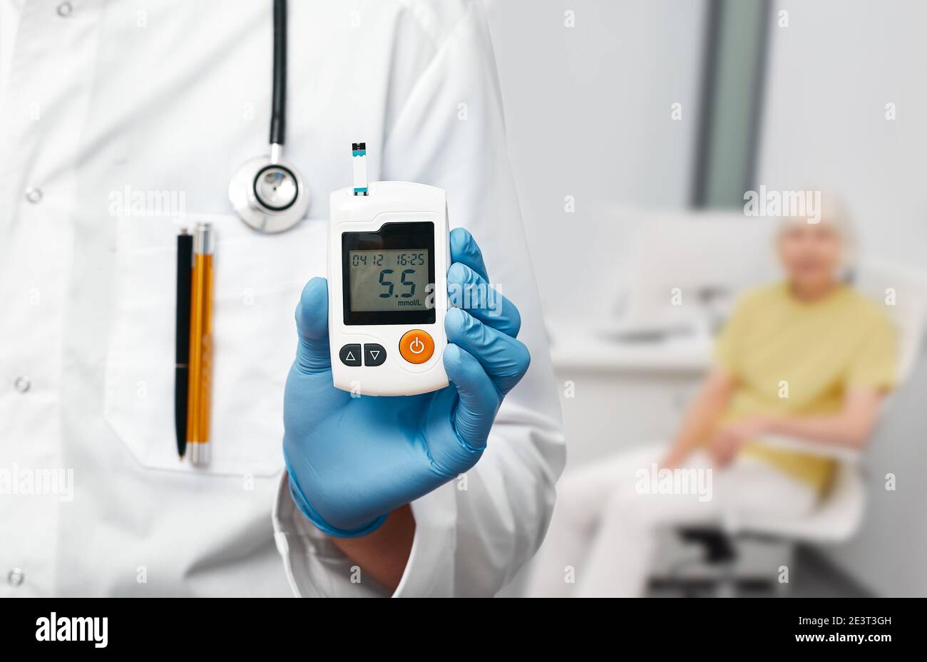 Endocrinology, blood sugar control using a glucometer. Endocrinologist and elderly patient with diabetes Stock Photo