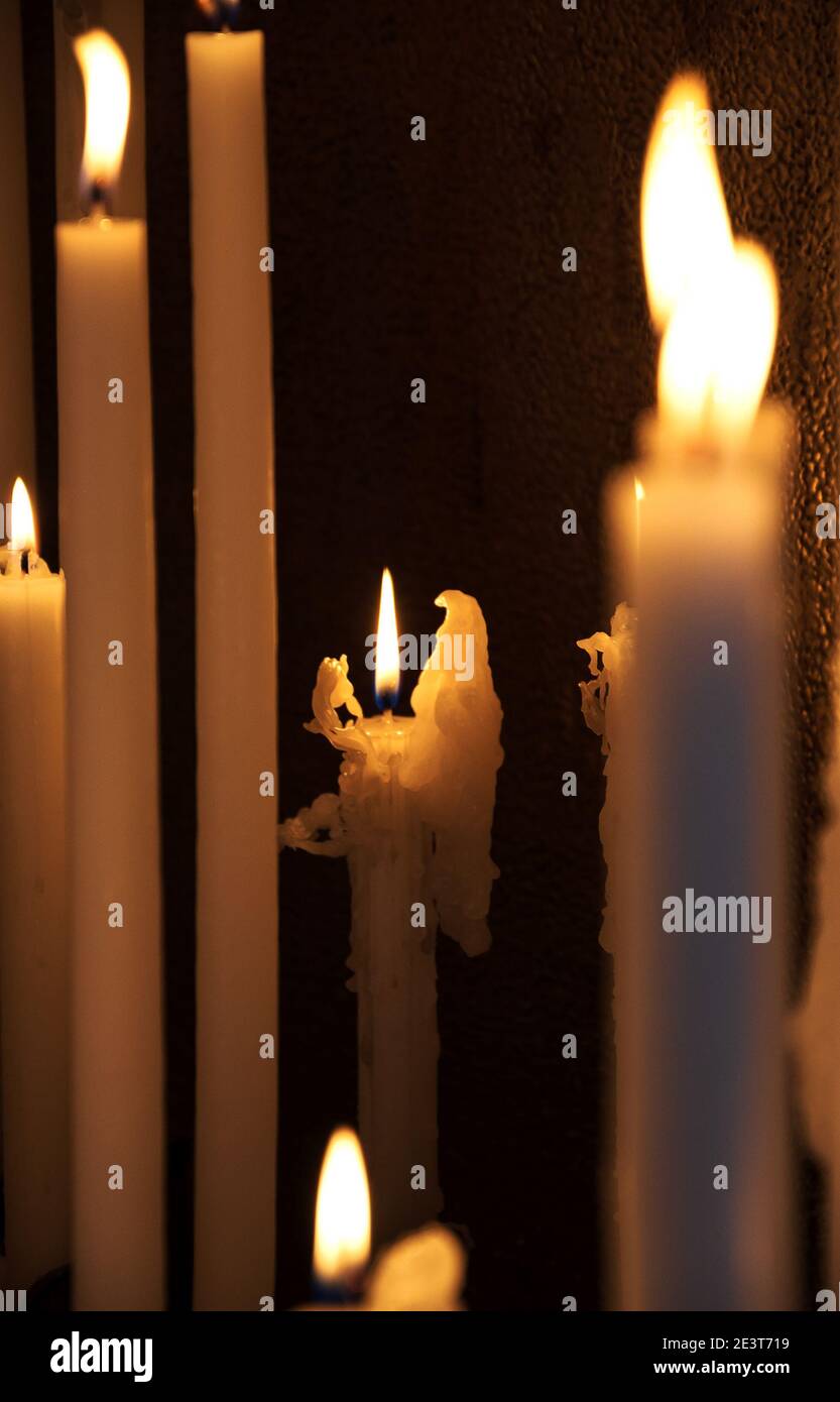 Angel candle (wax melted in shape of angel wings). Candles light in