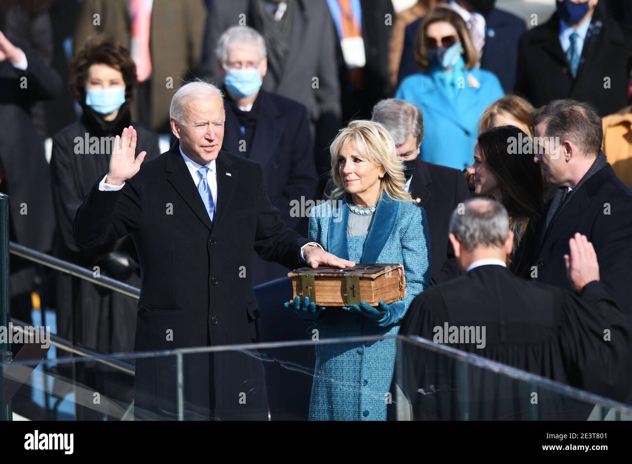 Washington, USA. 20th Jan, 2021. U.S. President-elect Joe Biden (L, Front) is sworn in as the 46th President of the United States in Washington, DC, the United States, on Jan. 20, 2021. At an unusual inauguration closed to public due to the still raging coronavirus pandemic, U.S. President-elect Joe Biden was sworn in as the 46th President of the United States on Wednesday at the West Front of the Capitol, which was breached two weeks ago by violent protesters trying to overturn his election victory. Credit: Liu Jie/Xinhua/Alamy Live News Stock Photo