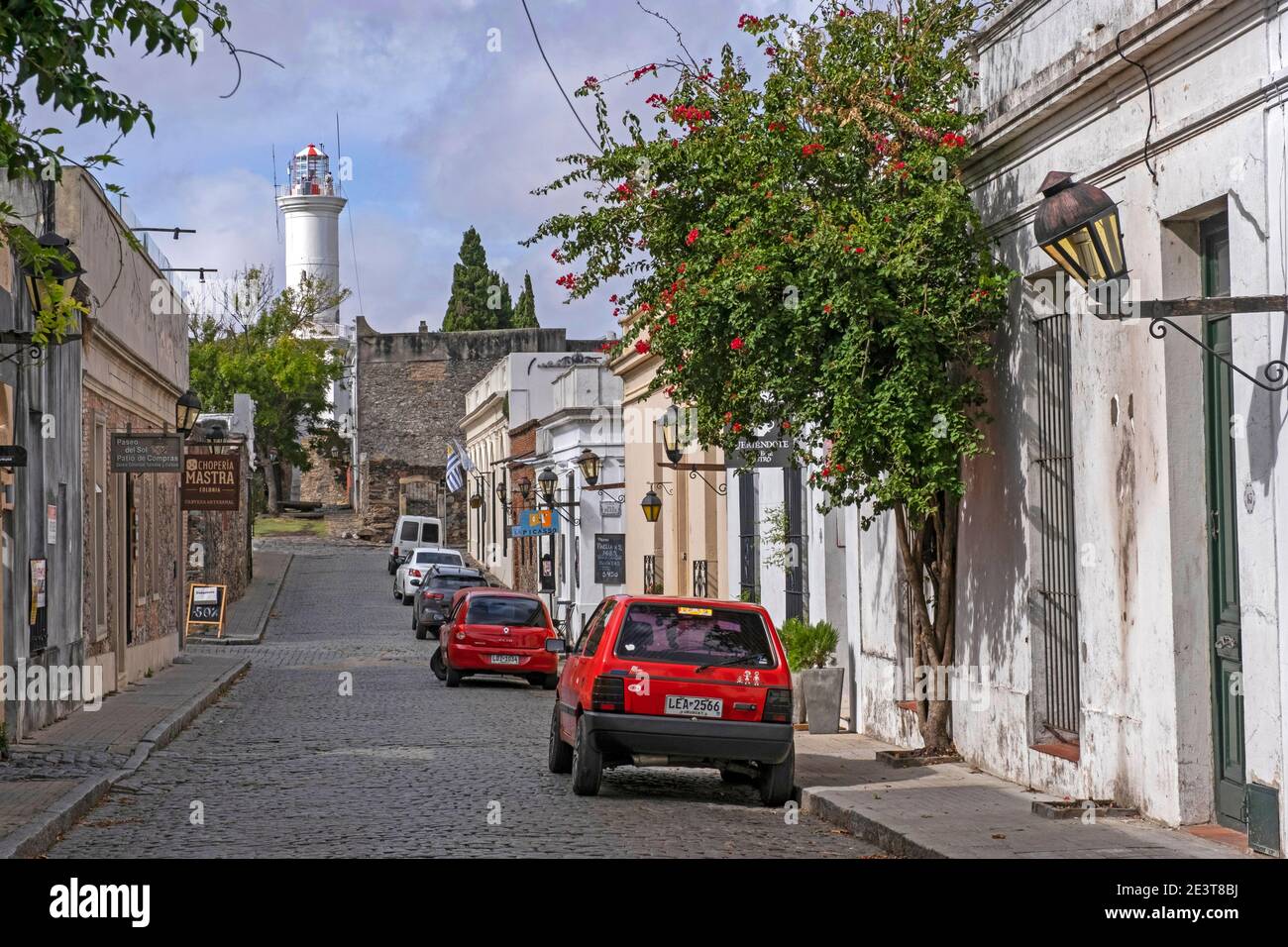 Cobbled street and lighthouse in the colonial Barrio Historico / historic quarter of the city Colonia del Sacramento, southwestern Uruguay Stock Photo