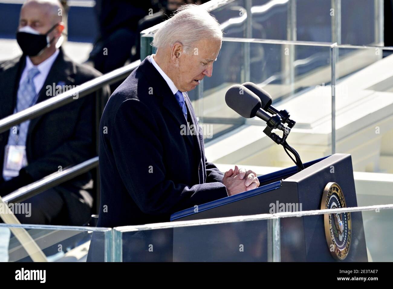 Washington, United States. 20th Jan, 2021. U.S. President Joe Biden, right, speaks during the 59th presidential inauguration in Washington, DC, U.S., on Wednesday, Jan. 20, 2021. Biden will propose a broad immigration overhaul on his first day as president, including a shortened pathway to U.S. citizenship for undocumented migrants - a complete reversal from Donald Trump's immigration restrictions and crackdowns, but one that faces major roadblocks in Congress. Photo by Kevin Dietsch/UPI Credit: UPI/Alamy Live News Stock Photo