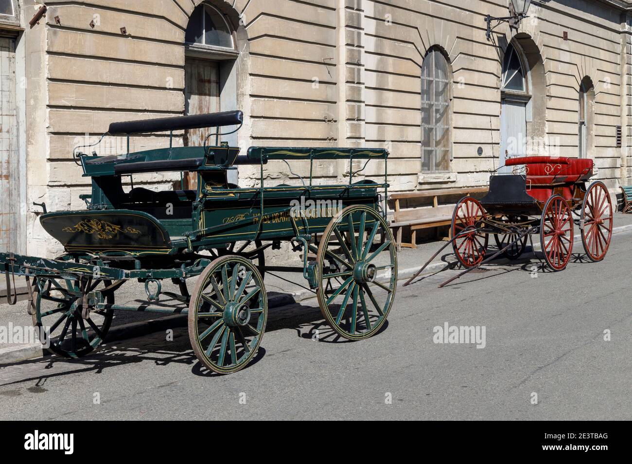Historic horse drawn carriages outside the museum in the Victorian Precinct, Oamaru, South Island, New Zealand, NZ. Stock Photo