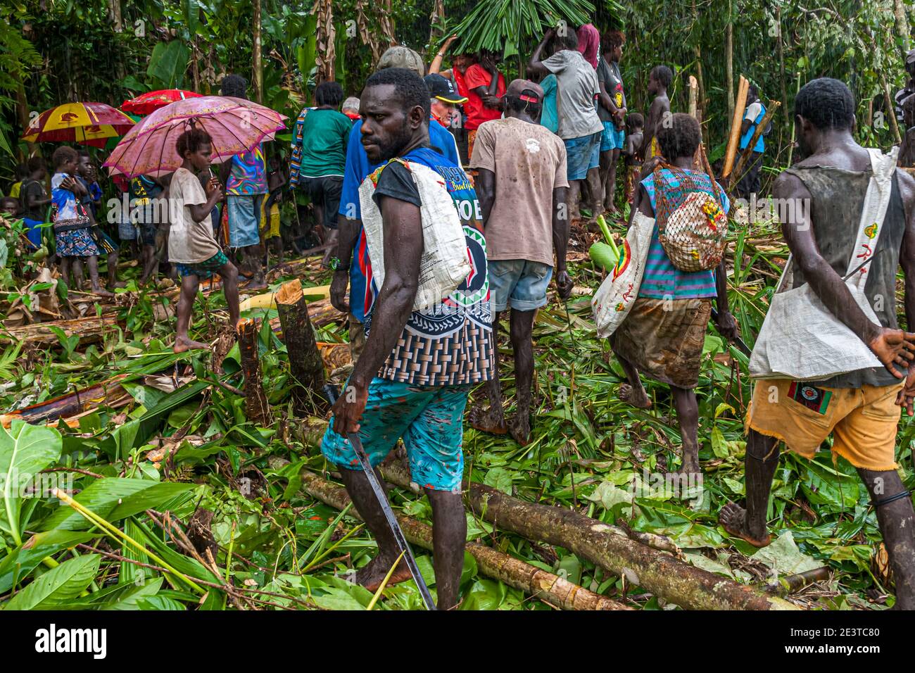 Native people with foreign guests in the bougainville jungle Stock Photo