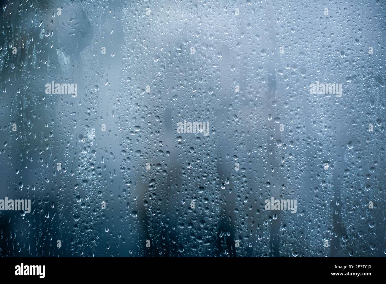 Rainy background, rain water drops on the window or in shower stall, autumn season backdrop, abstract textured wallpaper Stock Photo