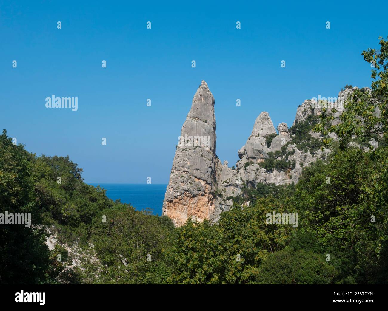 A view of limestone rock pillar Aguglia at Cala Goloritze beach at Gulf of Orosei. Famous travel destination. Sardinia, Italy, September Stock Photo