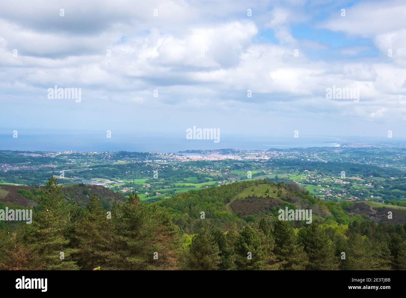 View from mountain of coastline  at Basque country on border between France and Spain in cloudy day. Hiking vacation background. Eco-planet concept. B Stock Photo