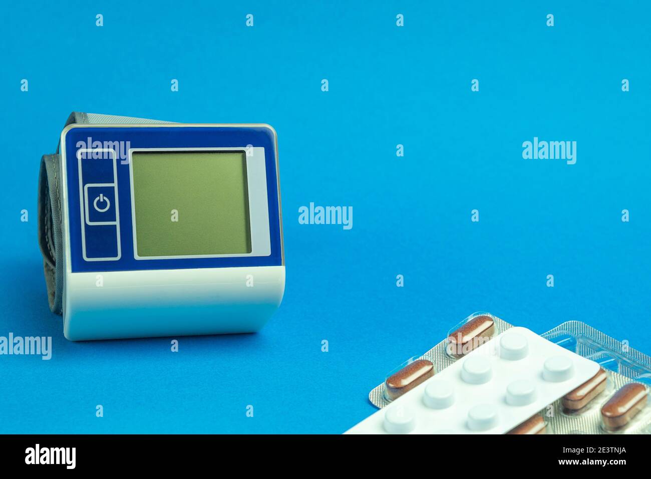 Blood pressure tonometer on a blue background. Background for text on a ...