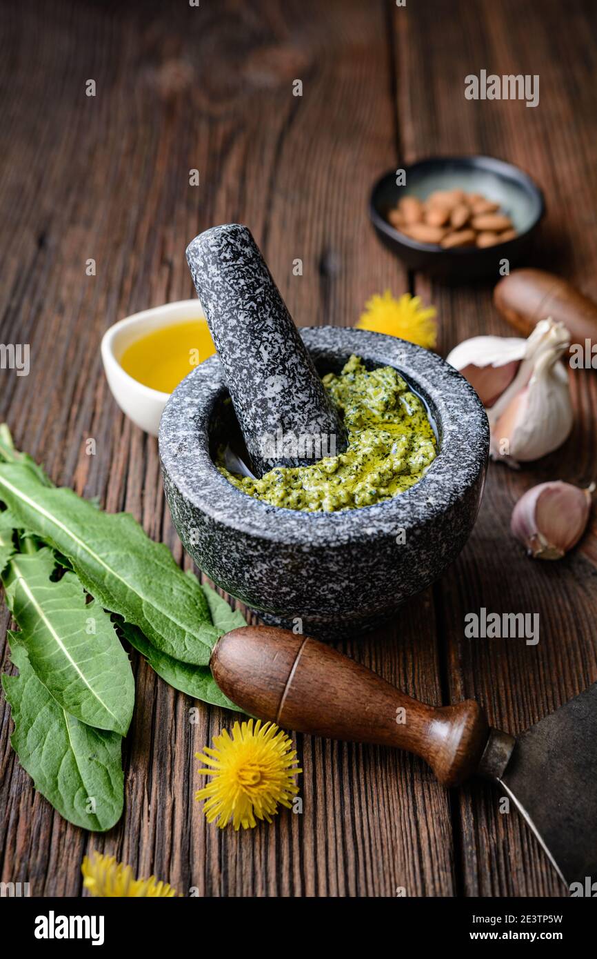 Healthy dandelion pesto with almonds, garlic, olive oil and Parmesan