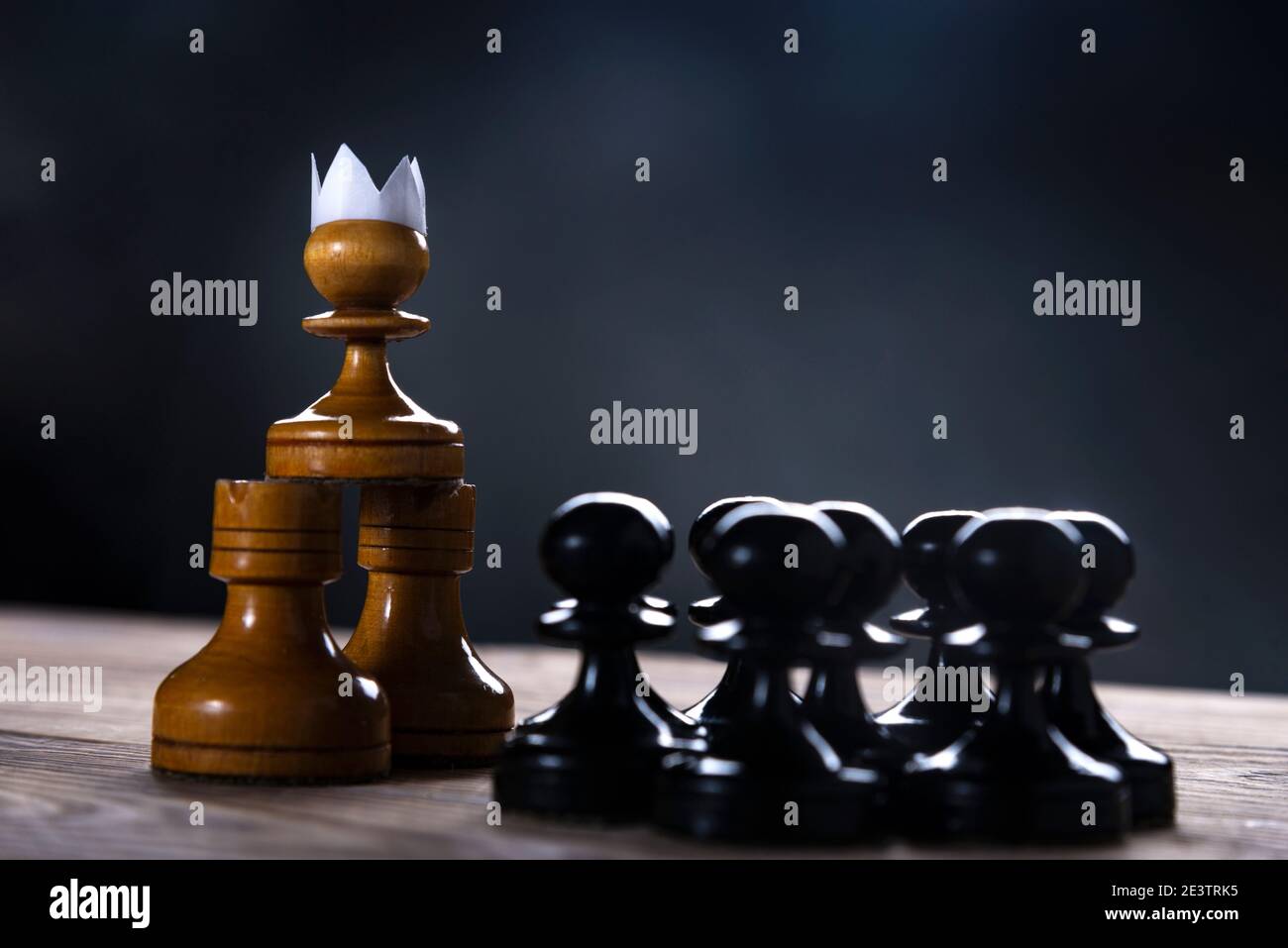 Investment Leadership Concept : The king chess piece with chess others  nearby go down from floating board game concept of business ideas and  competition and strategy plan success meaning. Stock Photo
