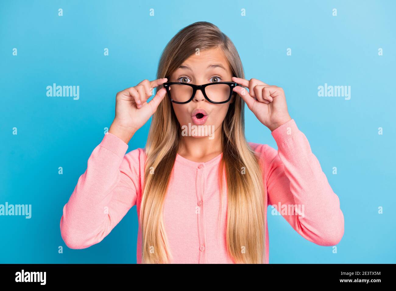 Photo portrait of shocked girl pulling glasses down isolated on pastel