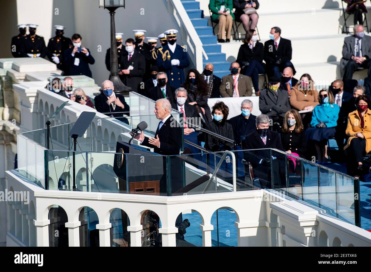 Washington, USA. 20th Jan, 2021. U.S. President Joe Biden (Front) delivers his inaugural address after he was sworn in as the 46th President of the United States in Washington, DC, the United States, on Jan. 20, 2021. At an unusual inauguration closed to public due to the still raging coronavirus pandemic, U.S. President-elect Joe Biden was sworn in as the 46th President of the United States on Wednesday at the West Front of the Capitol, which was breached two weeks ago by violent protesters trying to overturn his election victory. Credit: Liu Jie/Xinhua/Alamy Live News Stock Photo