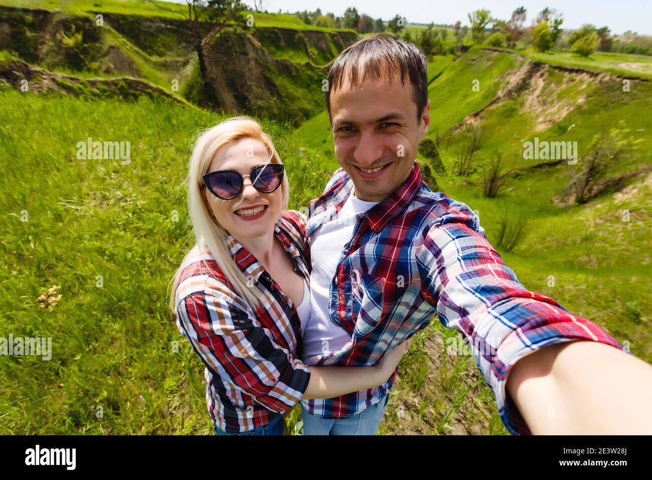 Two hikers taking selfie on top of the mountain Stock Photo - Alamy