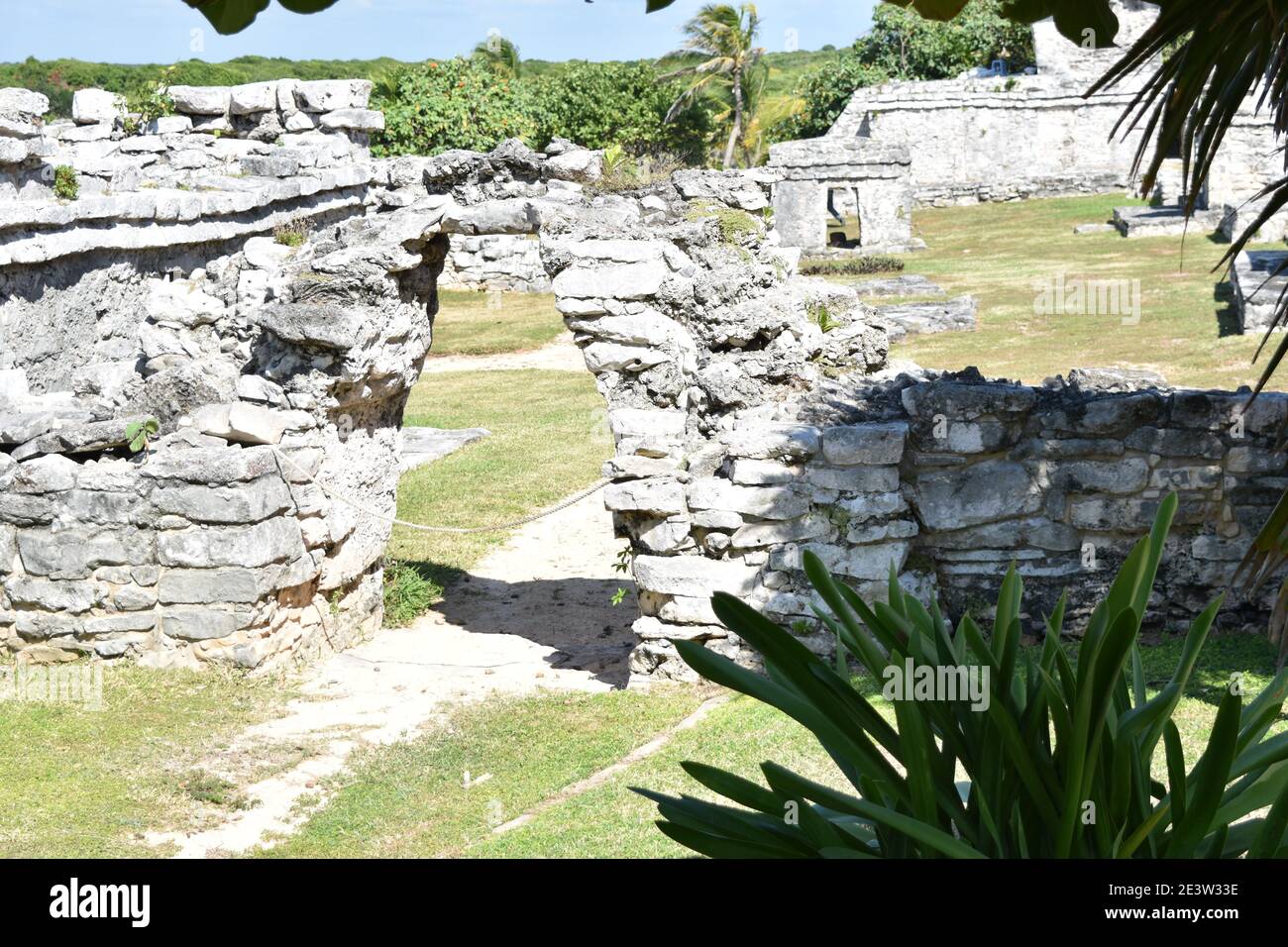 Stone framed passage and pathway among the Maya ruins from Tulum, Yucatan, Mexico Stock Photo