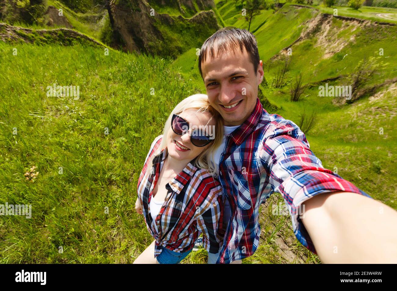 Two hikers taking selfie on top of the mountain Stock Photo - Alamy