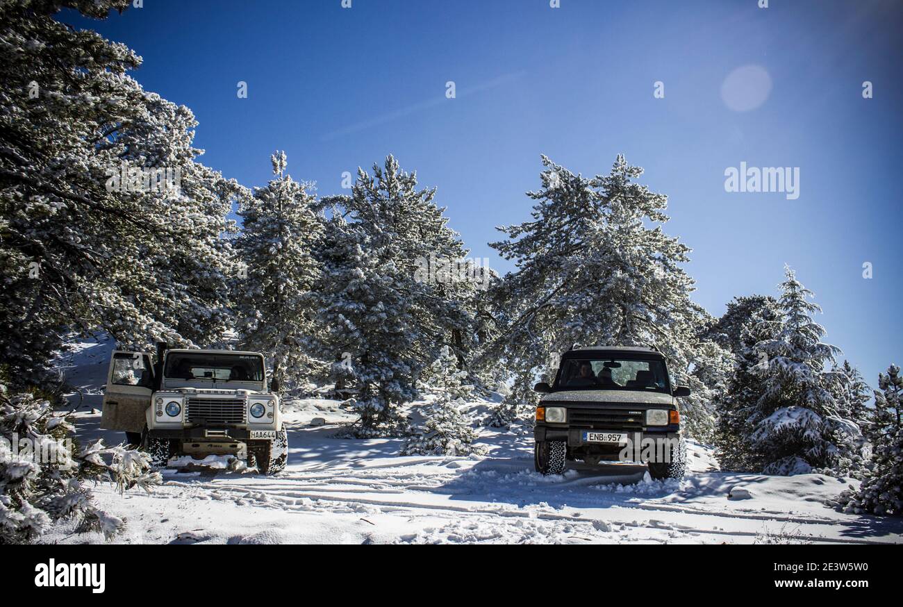 Off roading in the snow in the sunny mountains of Troodos Cyprus with a