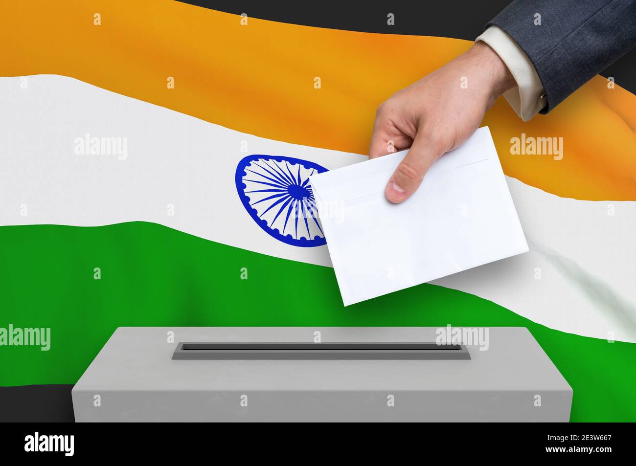 Election in India - voting at the ballot box. The hand of man is putting his vote in the ballot box. 3D rendered illustration. Stock Photo