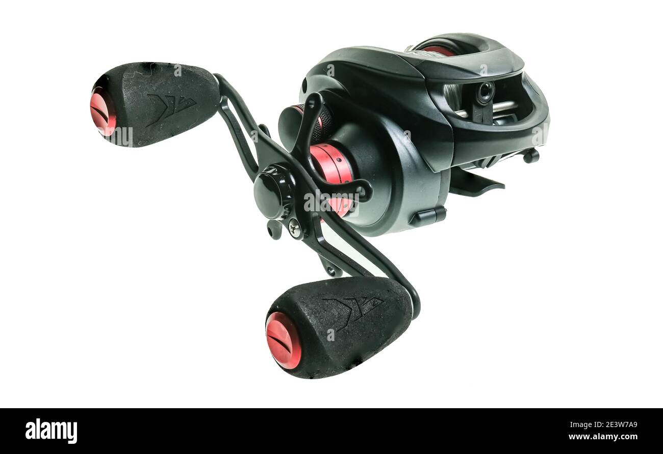 Close up of a black bait caster fishing reel spooled with braided