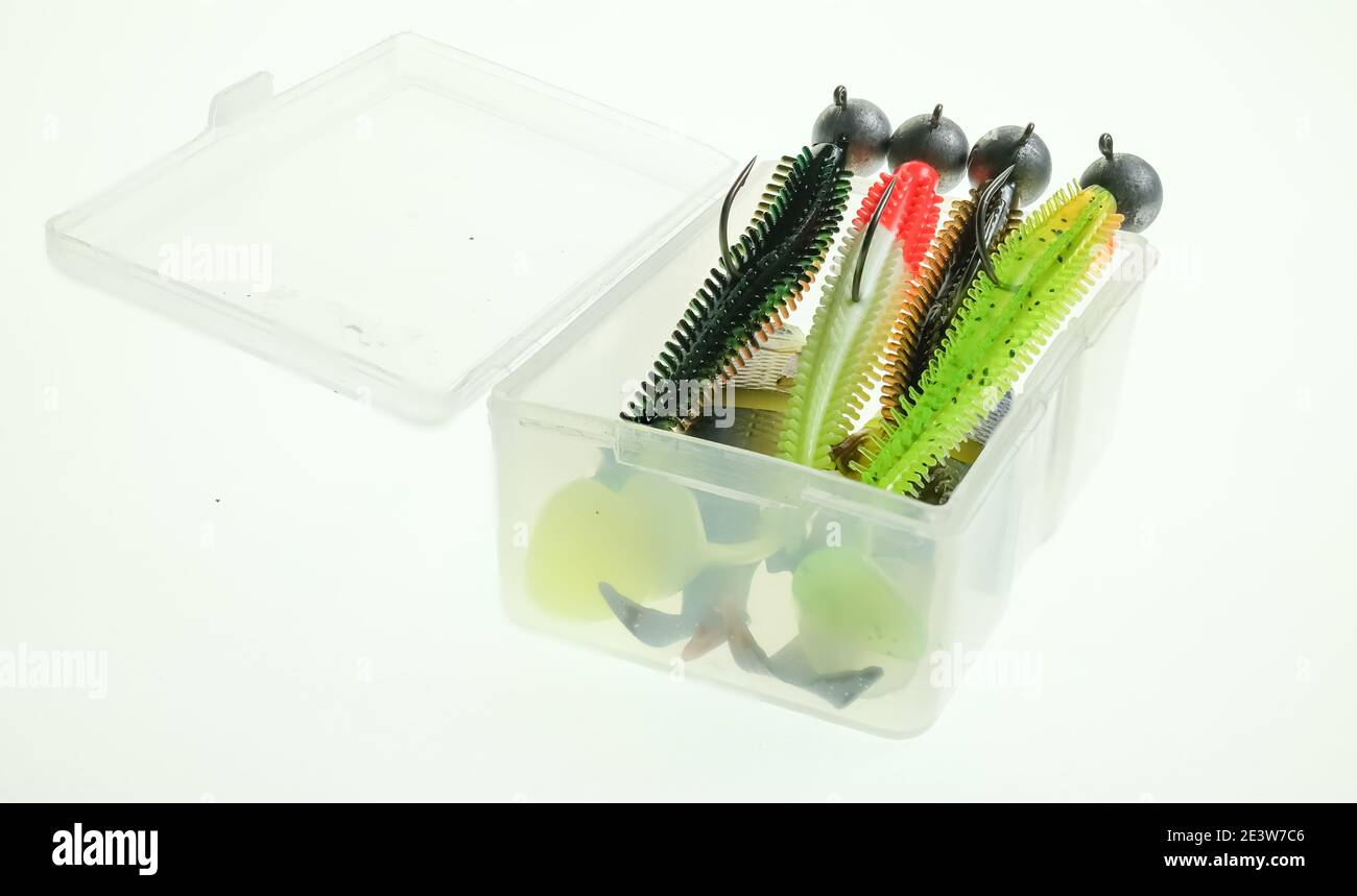 Close up of a plastic box of rubber lures on weighted jig heads used