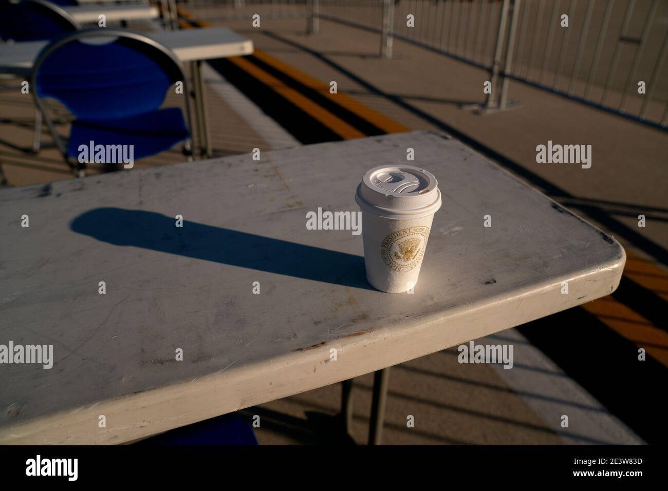 A cup with the Presidential seal on it is left behind following a farewell ceremony at Joint Base Andrews, Maryland, U.S., on Wednesday, Jan. 20, 2021. Trump departs Washington with Americans more politically divided and more likely to be out of work than when he arrived, while awaiting trial for his second impeachment - an ignominious end to one of the most turbulent presidencies in American history. Photographer: Stefani Reynolds/Bloomberg/MediaPunch Stock Photo