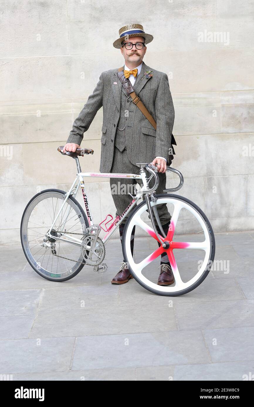 GREAT BRITAIN / England/London / Man and moustache posing with a bicycle at the Tweed Run . Stock Photo