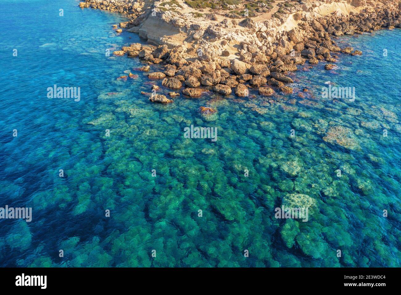 Aerial view of yellow stone island coast with azure and blue tropical sea water, summer travel concept, beautiful nature landscape. Stock Photo