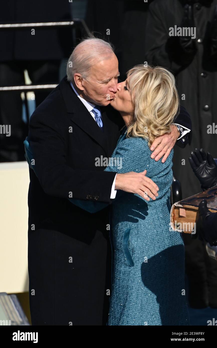 US President Joe Biden kisses incoming US First Lady Jill Biden after being sworn in as the 46th US President on January 20, 2021, at the US Capitol in Washington, DC. - Biden, a 78-year-old former vice president and longtime senator, takes the oath of office at noon (1700 GMT) on the US Capitol's western front, the very spot where pro-Trump rioters clashed with police two weeks ago before storming Congress in a deadly insurrection. (Photo by Saul LOEB/POOL/AFP)/MediaPunch Stock Photo