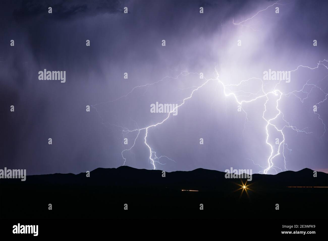 Lightning strike in the night sky from a monsoon thunderstorm near Whetstone, Arizona Stock Photo