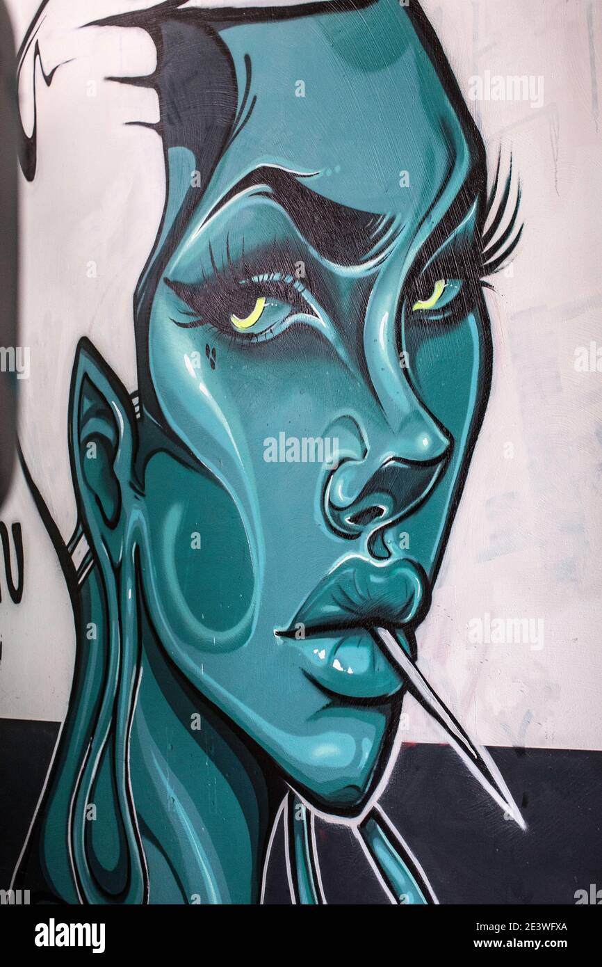 Woman with toothpick mural graffiti Stock Photo