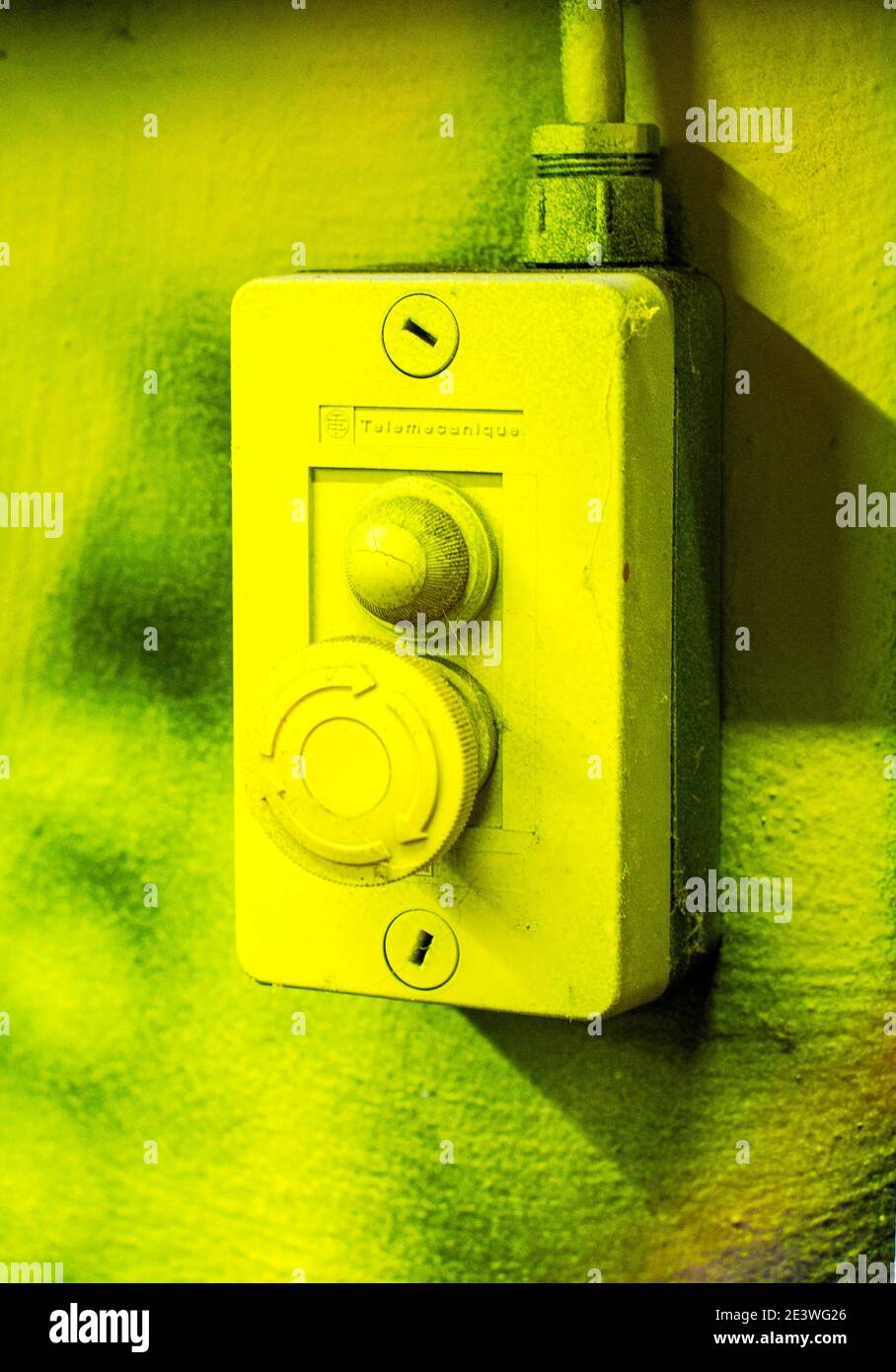 Old electric outlet on wall ,over painted with graffiti Stock Photo