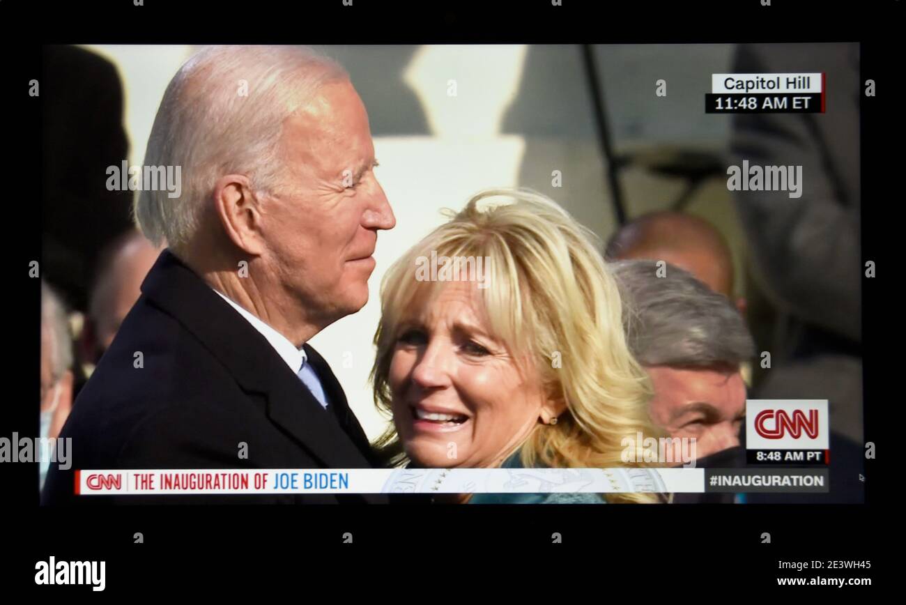 A CNN television screen shot of U.S. President Joe Biden and his wife, Jill Biden, after Biden was sworn in as the new U.S. President on Jan.20, 2021. Stock Photo