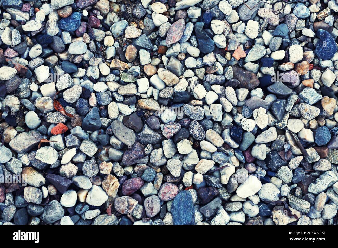 Rocky background with round stones in grey colours Stock Photo