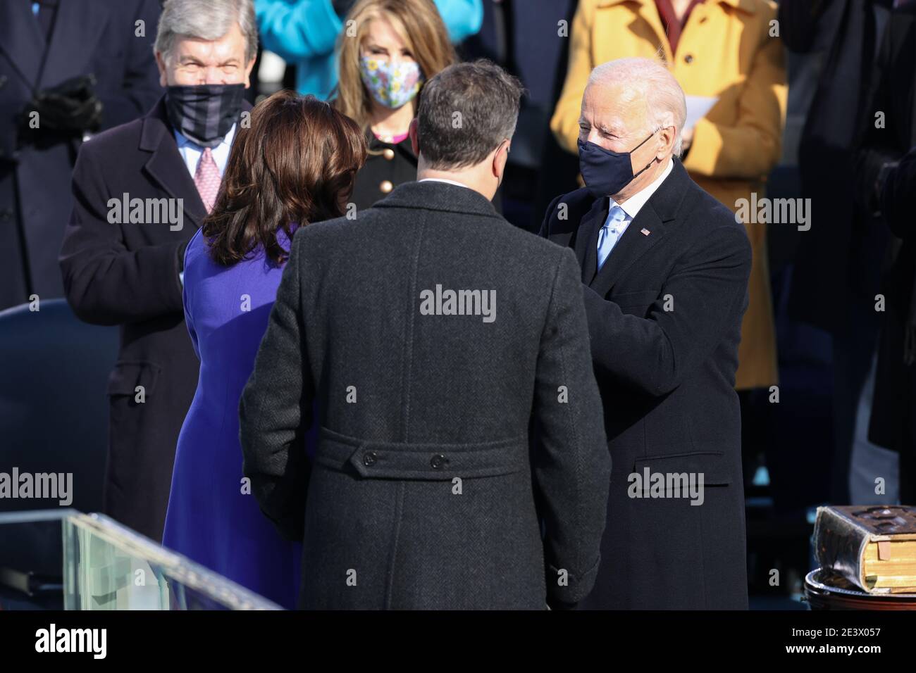 Washington, USA. 20th Jan, 2021.Doug Emhoff and Vice President-elect Kamala Harris are congratulated by President-elect Joe Biden during the Inauguration Day ceremony of President-Elect Joe Biden and Vice President-Elect Kamala Harris held at the U.S. Capitol Building in Washington, D.C. on Jan. 20, 2021. President-elect Joe Biden becomes the 46th President of the United States at noon on Inauguration Day. (Photo by Oliver Contreras/Sipa USA) Stock Photo
