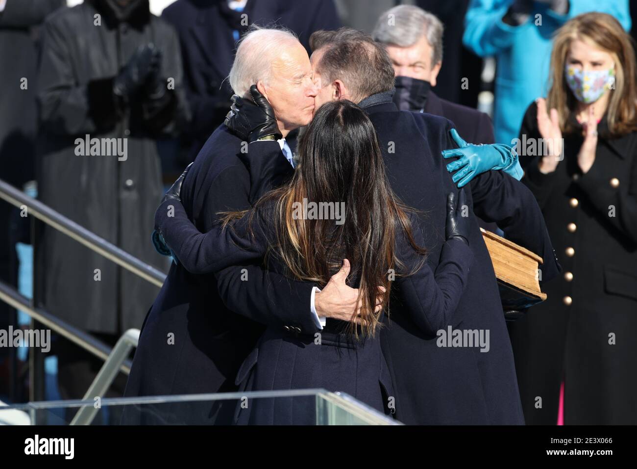 Washington, USA. 20th Jan, 2021.President Joe Biden, First Lady Jill Biden, Hunter Biden and Ashley Biden embrace during the Inauguration Day ceremony of President-Elect Joe Biden and Vice President-Elect Kamala Harris held at the U.S. Capitol Building in Washington, D.C. on Jan. 20, 2021. President-elect Joe Biden becomes the 46th President of the United States at noon on Inauguration Day. (Photo by Oliver Contreras/Sipa USA) Stock Photo