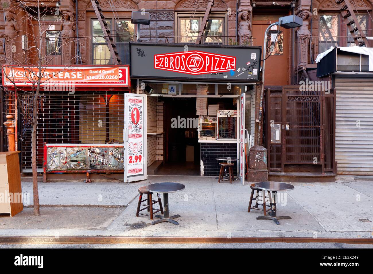 2 Bros Pizza, 32 St Marks Pl, New York, NY. exterior storefront of a dollar pizza store chain in Manhattan's East Village neighborhood. Stock Photo