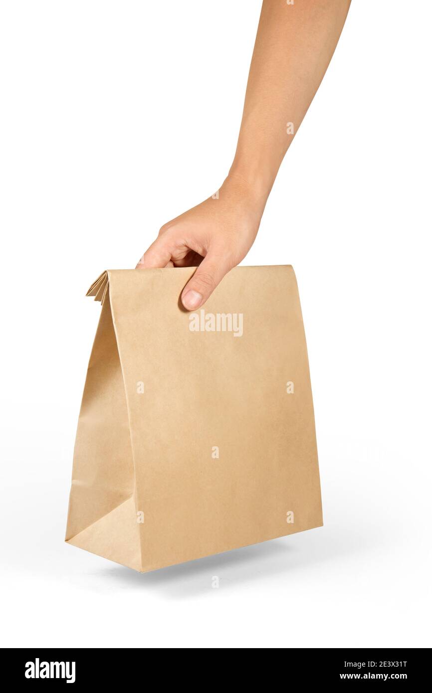 Right hand holding a brown paper bag isolated on white with clipping ...