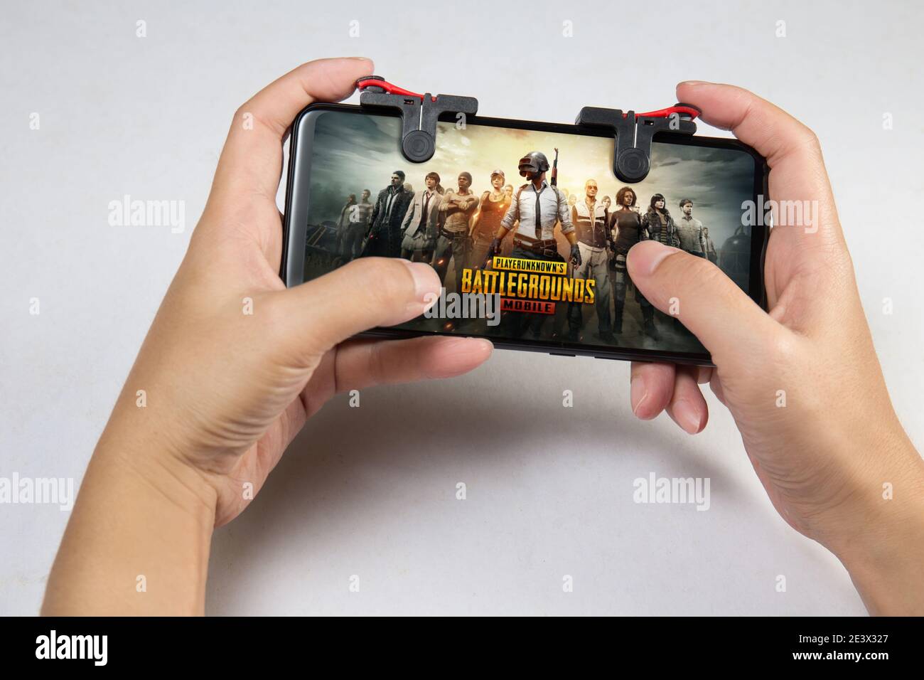 Kuala Lumpur, Malaysia - 2 December 2018: Hand holding a smartphone with Player's Unknown Battleground also known as PUBG online shooting gaming Stock Photo