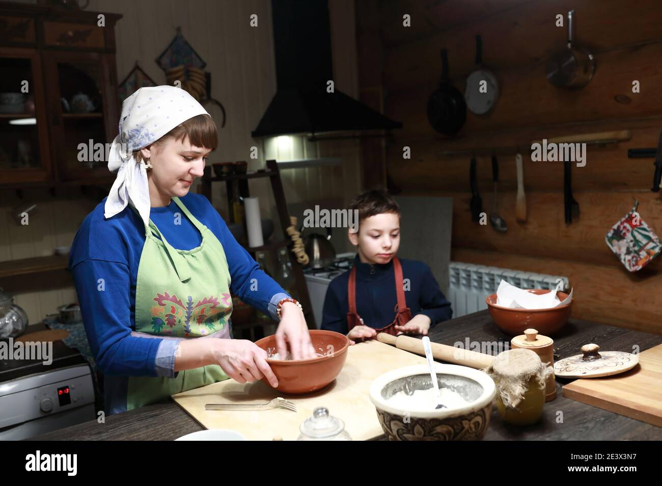 Cook making dough in bowl in kitchen Stock Photo