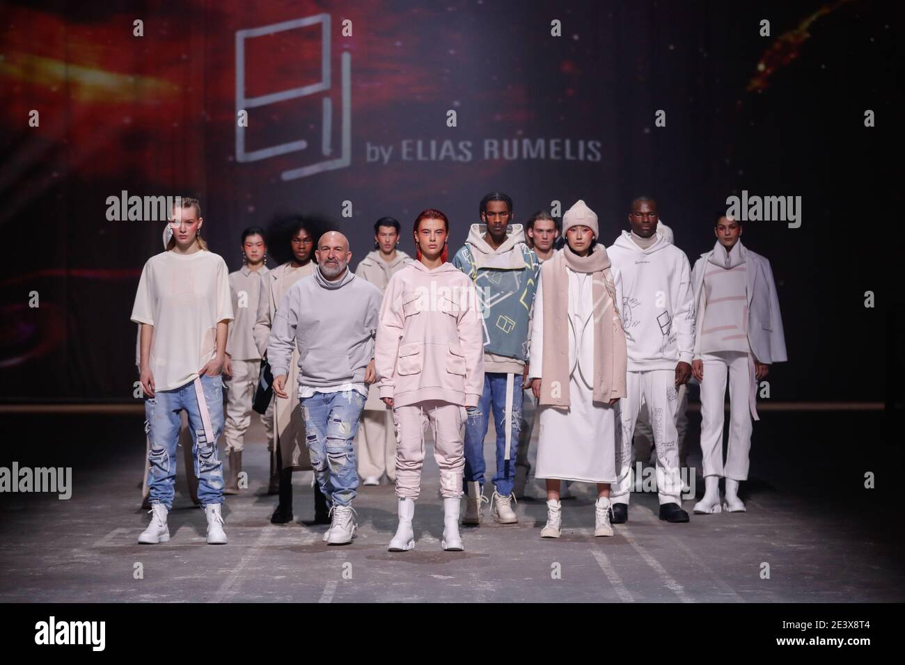 Berlin, Germany. 20th Jan, 2021. Designer Elias Rumelis shows off with  models after his show on the catwalk he presented his collection for the  fall/winter season 2021/2022 at the Mercedes-Benz Fashion Week