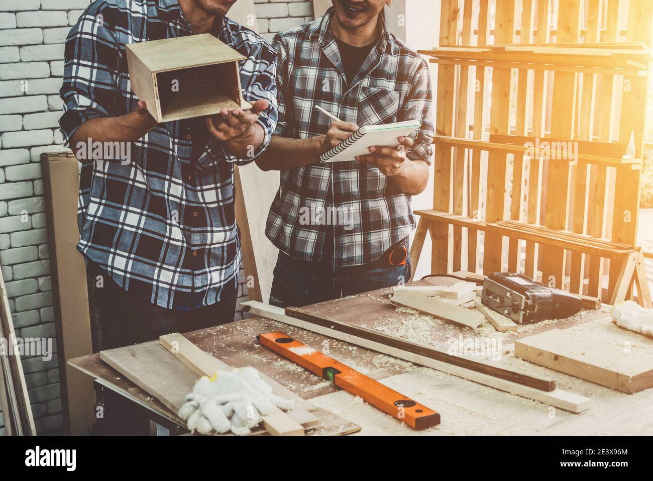 Carpenter working on wood craft at to produce construction