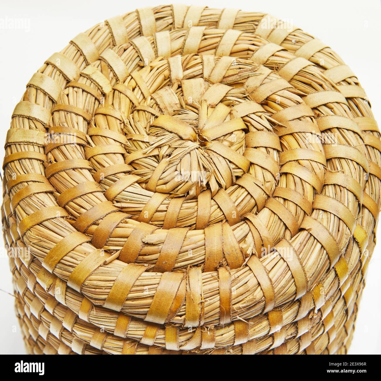 Handmade natural product, round wicker basket, rattan weaving. Eco friendly and sustainable concept. Eco-friendly shopping and recycled gifts. Stock Photo