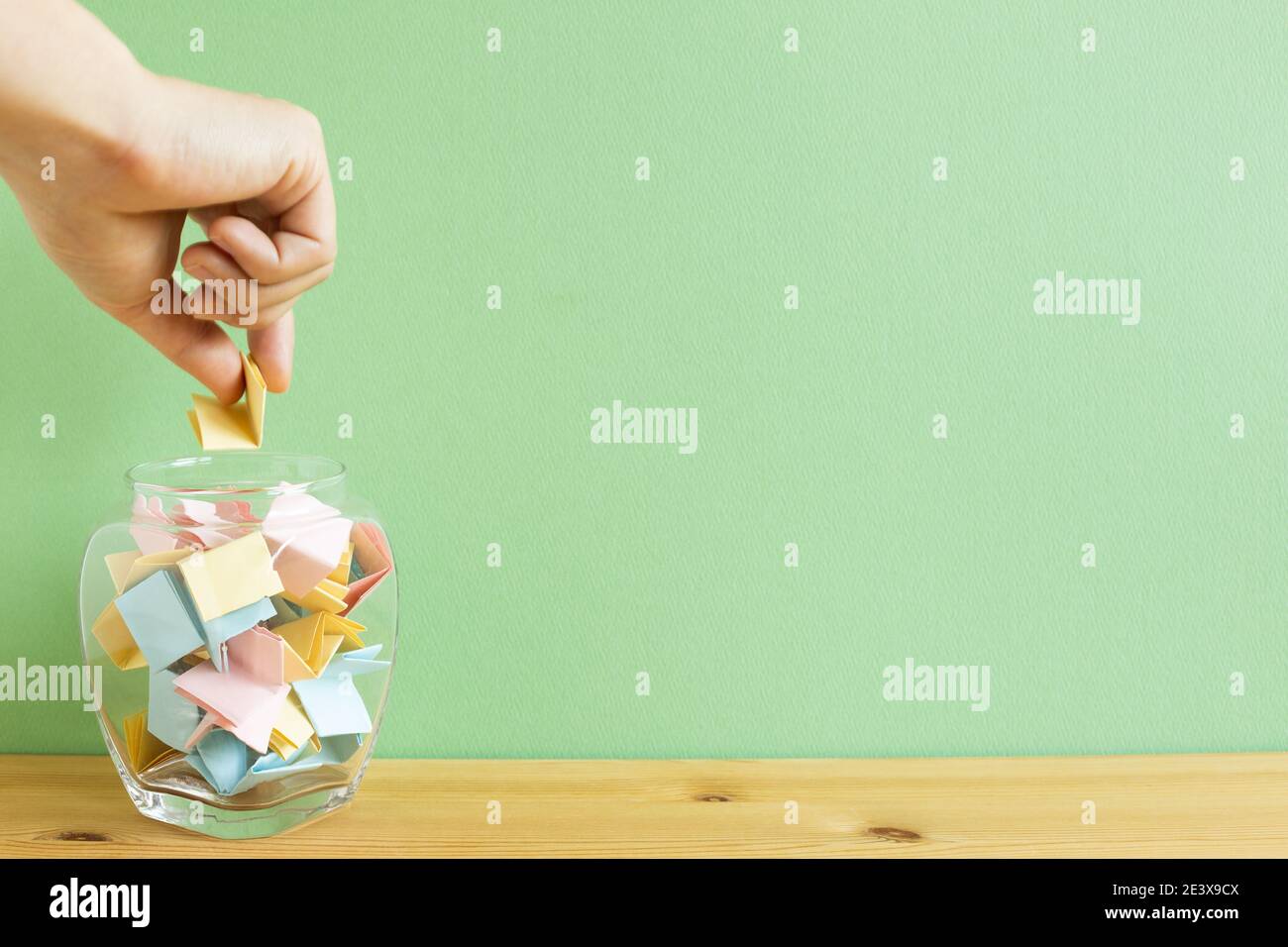 Draw lots. Folded colorful papers in bowl Stock Photo Alamy