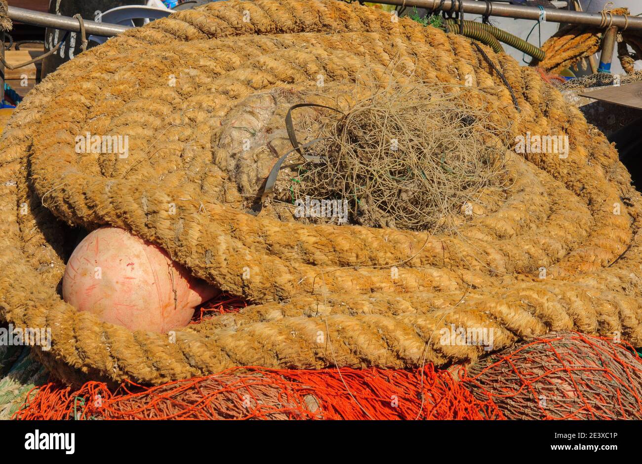 Rolls of ropes and fishing nets in a fishing harbor Stock Photo Alamy