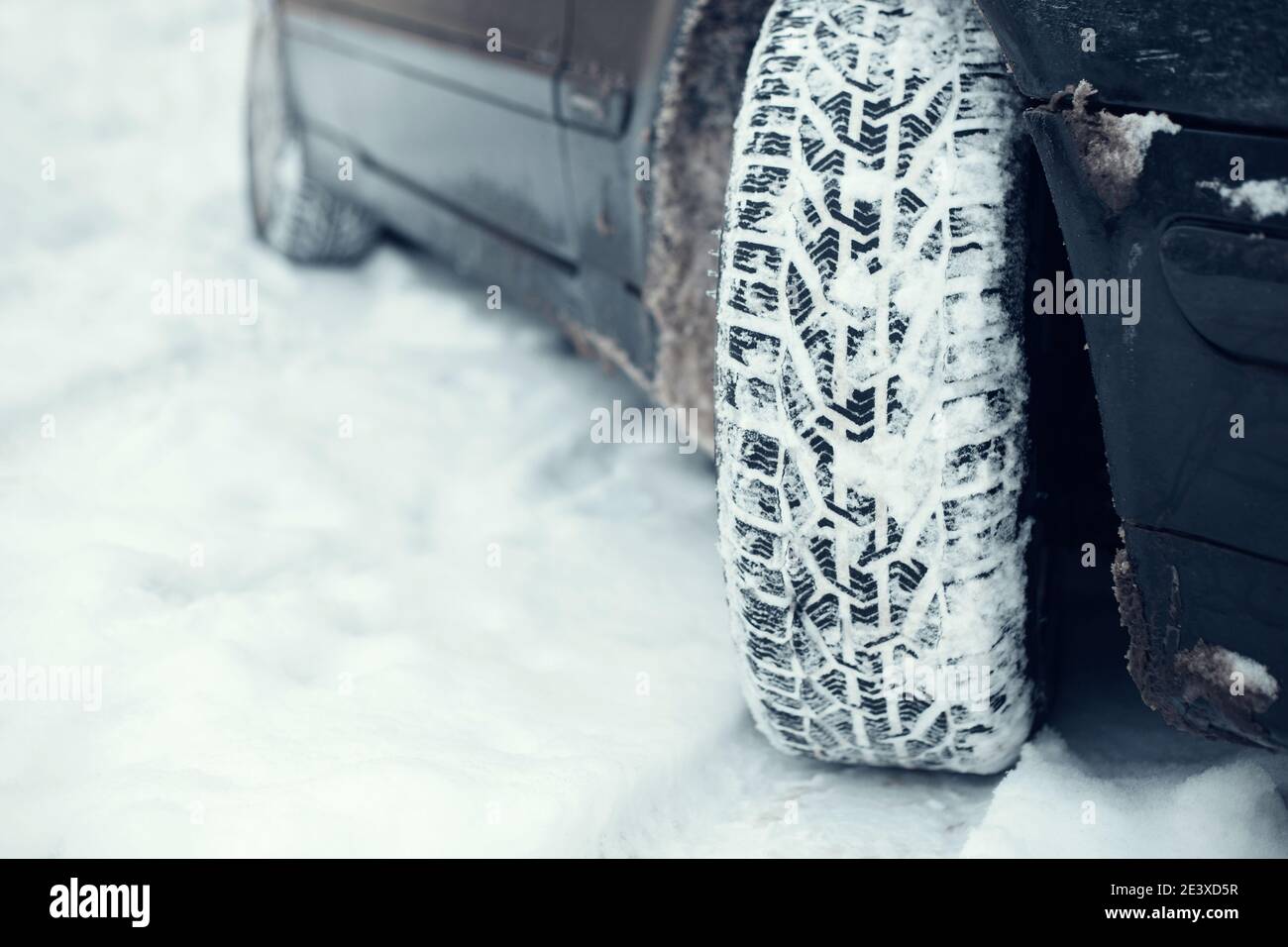 Car on snow winter tires for grip stability and safety in cold