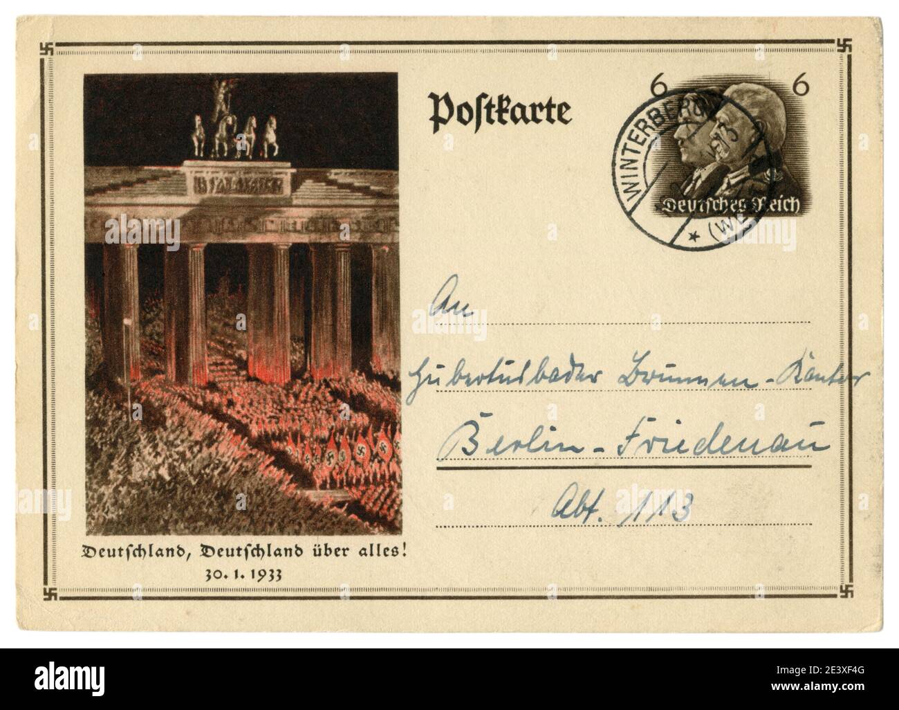 German historical postal card: Anniversary of the overthrow of power. SA troops pass by the Bradenburg gate. 30 january 1933, Germany, Third Reich Stock Photo