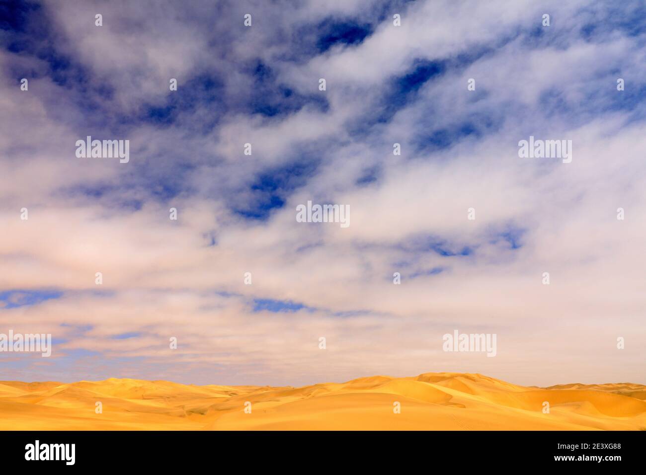 Blue sky with sand dune. Landscape in Namibia, Africa. Travelling in the desert. Yellow sand hills. Namib Desert, sand dune mountain with beautiful bl Stock Photo