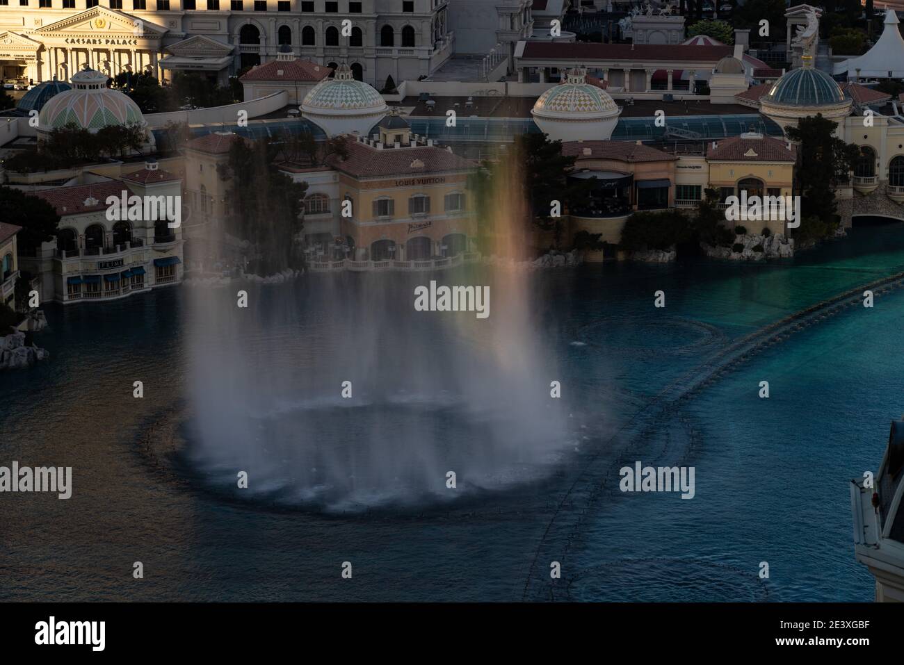 The Fountains of Bellagio revealing small rainbows as the sun starts to set on the Las Vegas Strip Stock Photo
