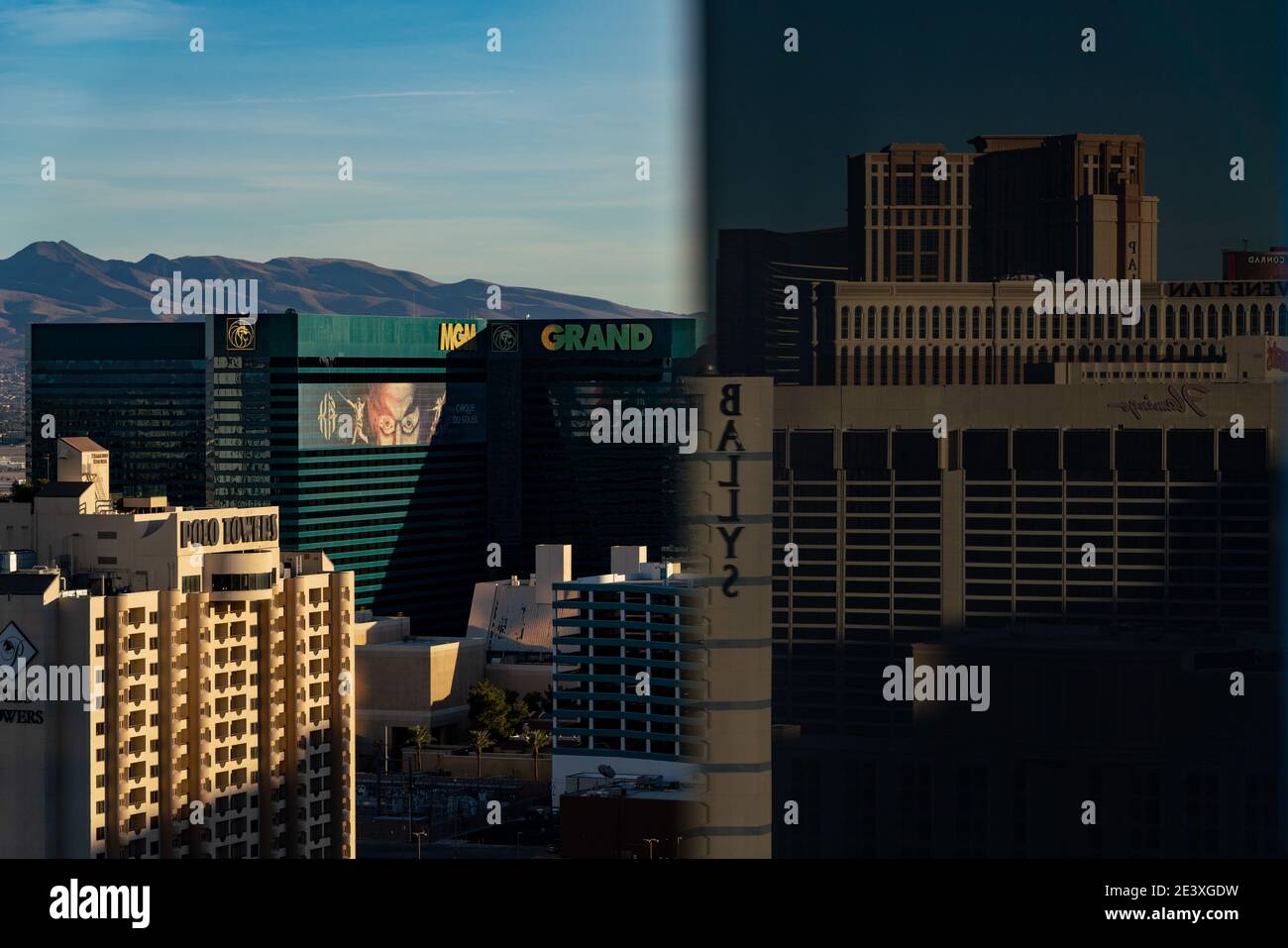 The MGM Grand is seen from a balcony at the Cosmopolitan of Las Vegas with Bally's, Flamingo, Venetian, and Palazzo reflected in the glass Stock Photo