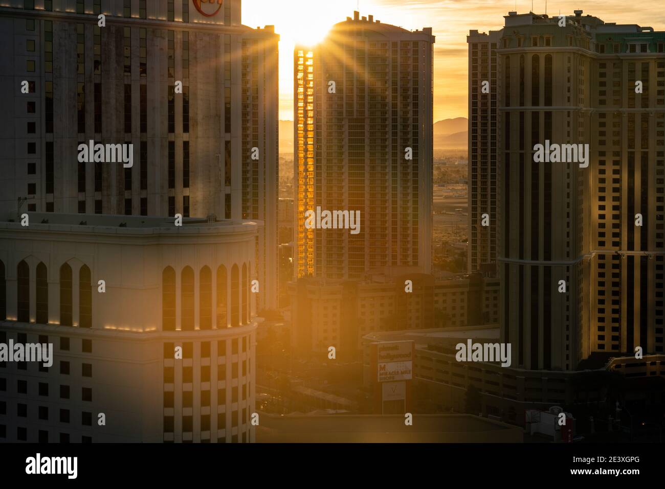 The sun rises behind Luxuary Suite International at The Signature in Las Vegas, NV Stock Photo