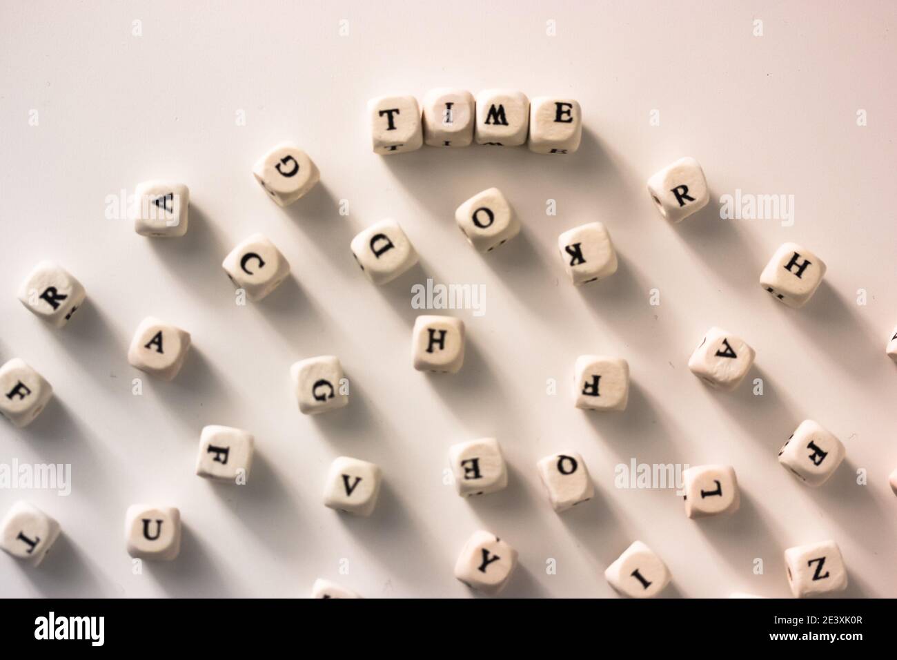 Time - the words written on wood blocks, white table, black and white ...